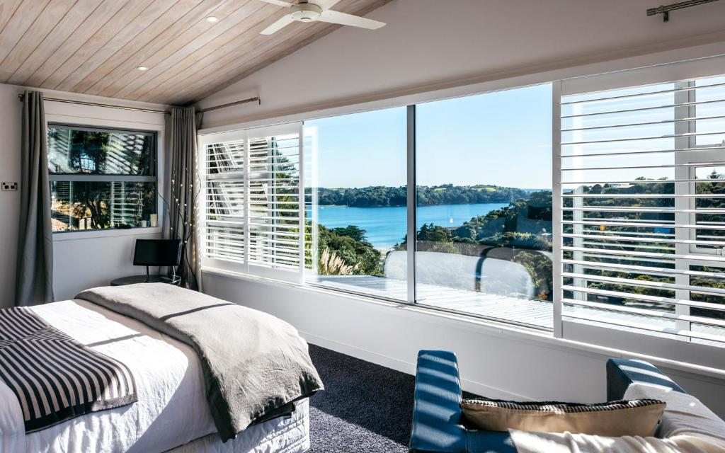 Wild Thyme — bright bedroom with coastal views through plantation shutters